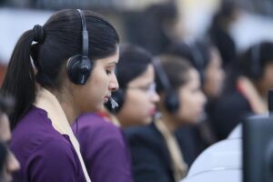 Chatbot Installation and Training Call center agents wearing headsets working in a focused office environment.